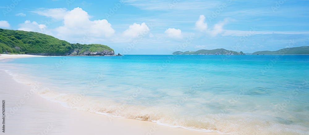 A serene beach with pristine white sands and crystal clear waters A serene beach with pristine white sands and crystal clear waters