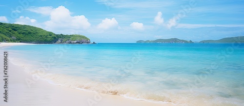 A serene beach with pristine white sands and crystal clear waters