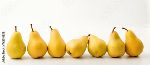 A Row of Fresh Pears on White Background