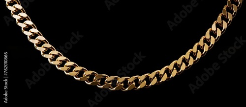 Gold necklace on black background