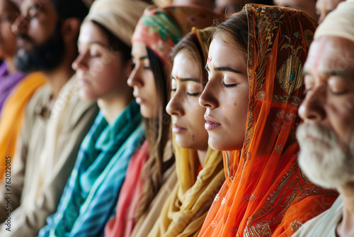 close-ups of women with headscarves praying together