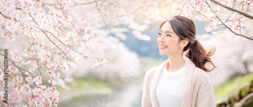 A fresh woman smiling in a spring background.