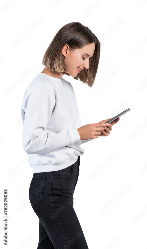 A woman in casual wear looking at a smartphone against a white background. Lifestyle and technology concept A woman in casual wear looking at a smartphone against a white background. Lifestyle and technology concept