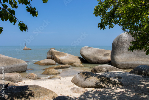 Tropical beach with boulders in Batu Ferringgi, Penang, Malaysia, Asia