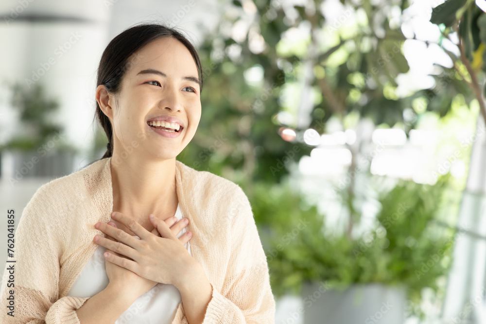 Happy, smiling, friendly asian woman in casual dress, showing being impressed gesture expression. Happy, smiling, friendly asian woman in casual dress, showing being impressed gesture expression.