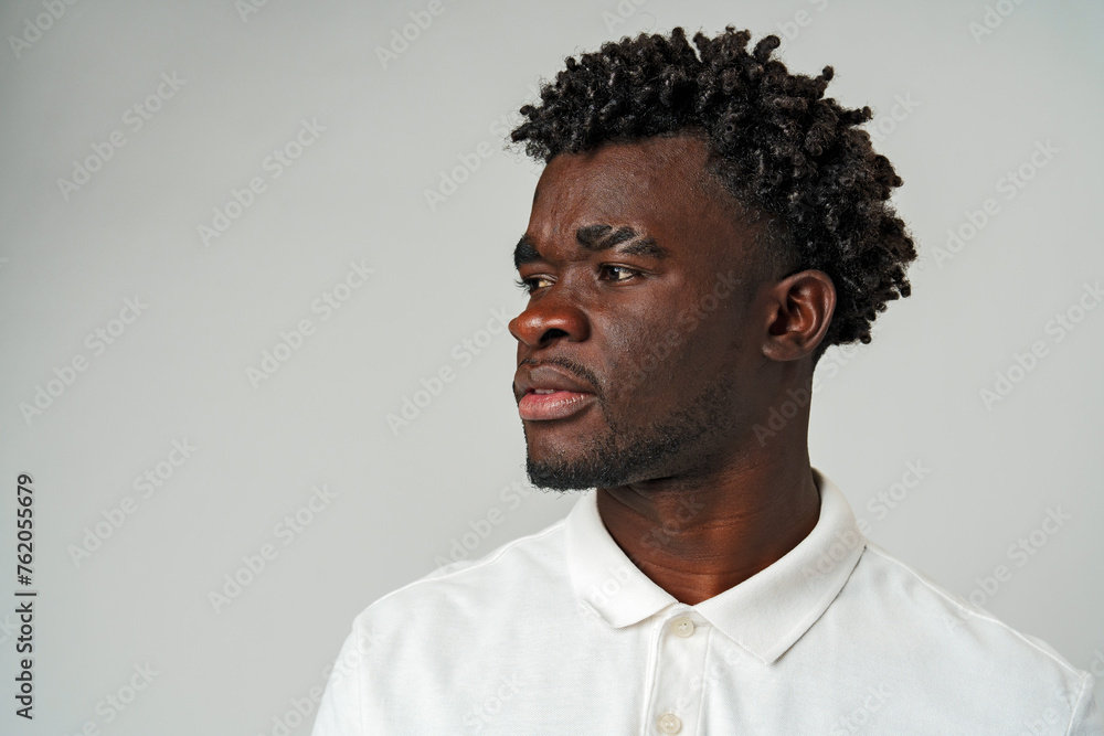 African Man in White Shirt Looking Sideways African Man in White Shirt Looking Sideways