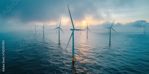  electricity wind turbine on blue sea with blue sky with foggy weather, offshore wind farm, photo