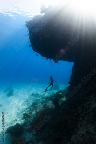 person snorkeling underwater
