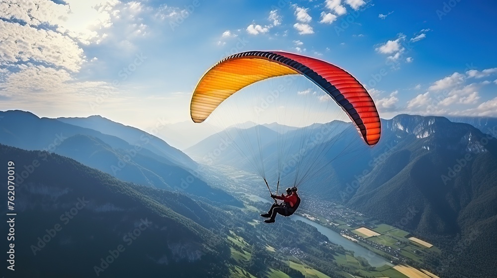 Fototapeta premium paraglider man drifting in beautiful mountains