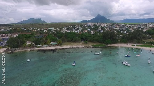Mauritius island and Flic en Flac beach Indian Ocean Coastline. Sandy Beach and Yachts Boats in Background photo