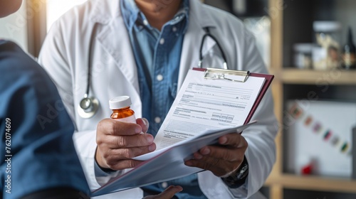 A male physician hands a prescription to a patient, promoting the concept of a universal and life-saving treatment in a legal pharmacy with a blank form available for use. photo