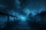 Old wooden bridge with fog and smoke under a starry night landscape.