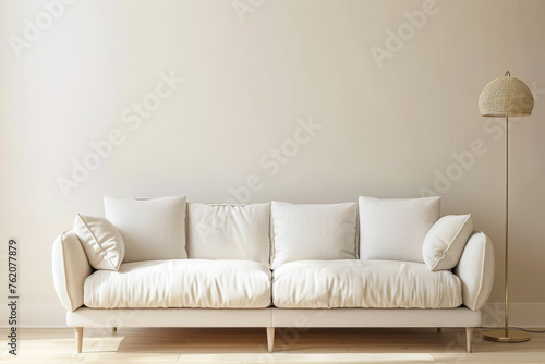 Minimalist living room interior in warm serene tones with a sofa and a lamp as decor