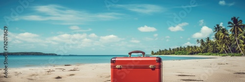 Red suitcase on the beach © shelbys