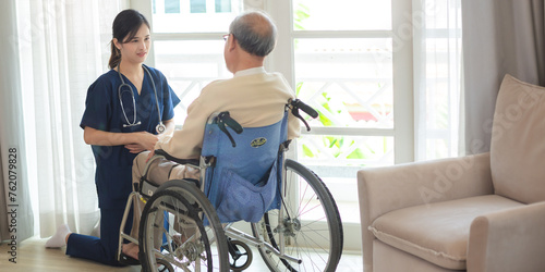 asian woman doctor nursing home to helping take care to retirement patient who sitting on wheelchair, caregiver nurse support to medical health care insurance at home or hospital, elderly senior man