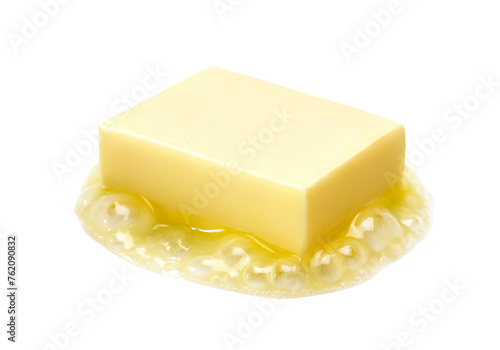 A piece of melting butter isolated
