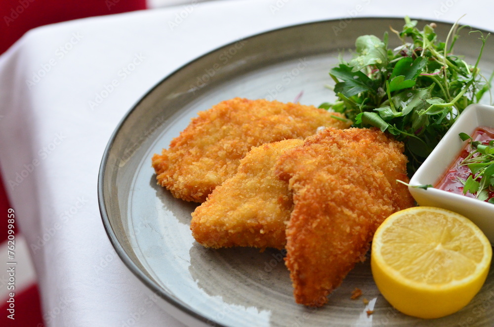 traditional Czech food, fried pork steak, close-up view, served on a plate traditional Czech food, fried pork steak, close-up view, served on a plate
