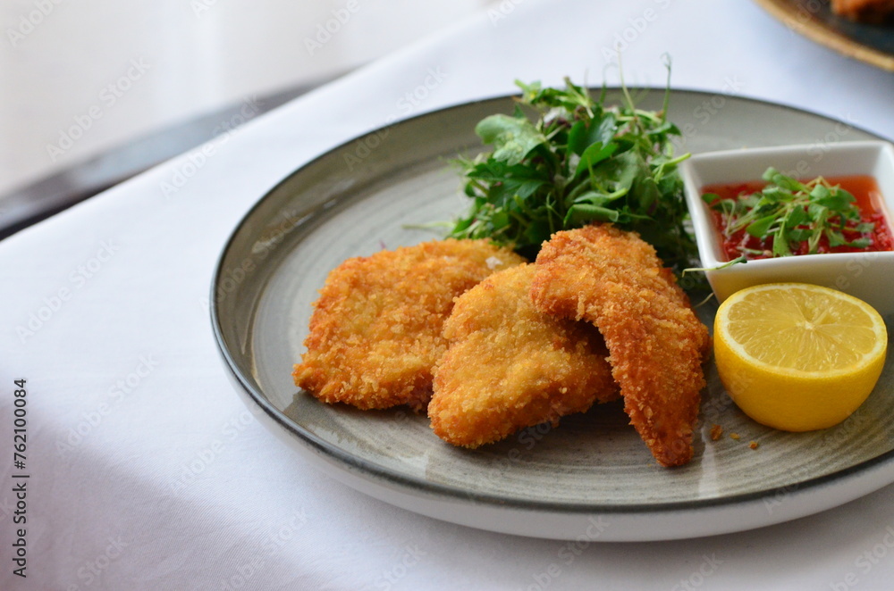 fried chicken schnitzel, food background, serving food, rustic plate, restaurant menu fried chicken schnitzel, food background, serving food, rustic plate, restaurant menu