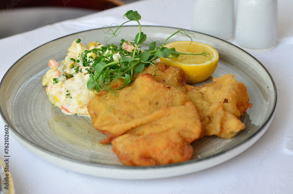 traditional Czech food, fried pork steak, close-up view, served on a plate traditional Czech food, fried pork steak, close-up view, served on a plate