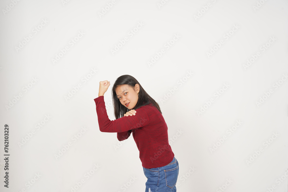 Young Asian woman in Red t-shirt Showing strong arms, emancipation of women concept isolated on white background Young Asian woman in Red t-shirt Showing strong arms, emancipation of women concept isolated on white background