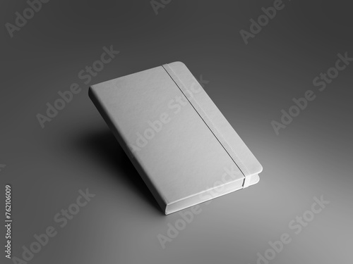 Mockup of a textured white closed notebook with an elastic band, diary with a hard cover, isolated on a background with dark shadows.