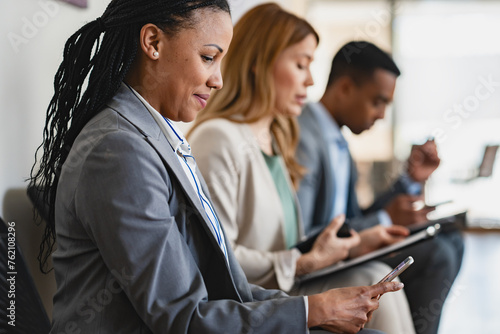 Bild auf Leinwand A diverse group of multi-ethnic people waiting for a job interview in front of a