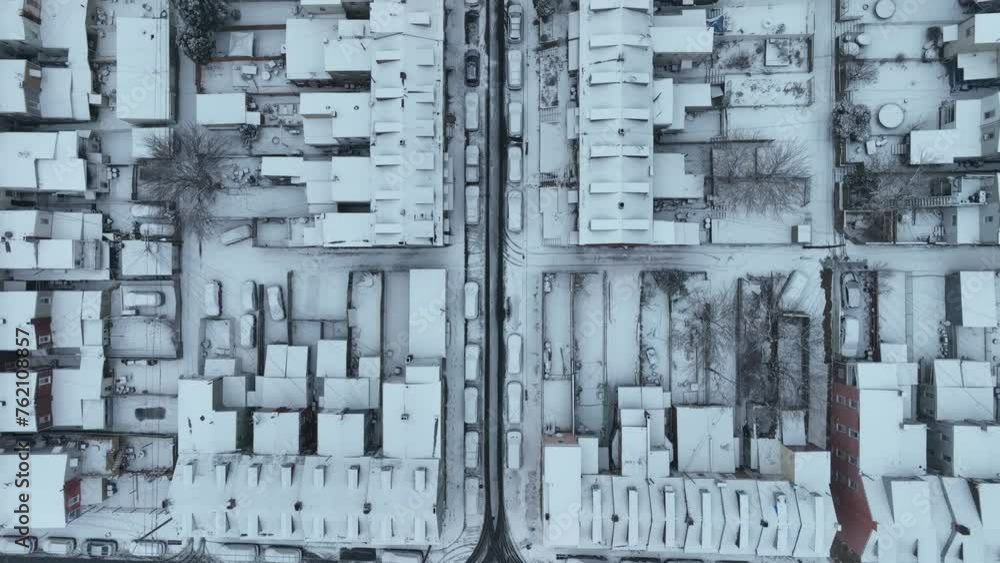 White snow covered housing area with blocks, Settlement and apartments in american town. Aerial top down forward flight. White snow covered housing area with blocks, Settlement and apartments in american town. Aerial top down forward flight.