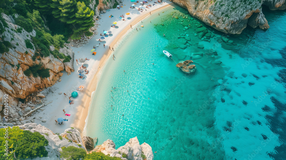 A picturesque aerial view of the serene beach with a solitary boat floating peacefully in the crystal-clear water