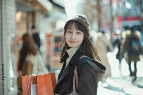 a Woman walking street and smiling , holding shopping bags 