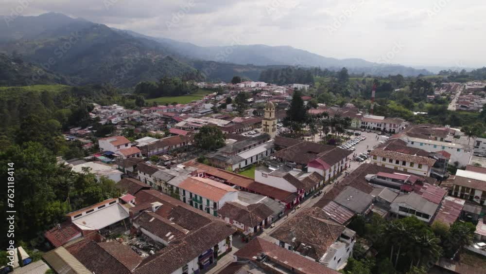 Aerial orbit shot of Our Lady of Carmen Church in Salento Town with Mountains in Background, Colombia Aerial orbit shot of Our Lady of Carmen Church in Salento Town with Mountains in Background, Colombia