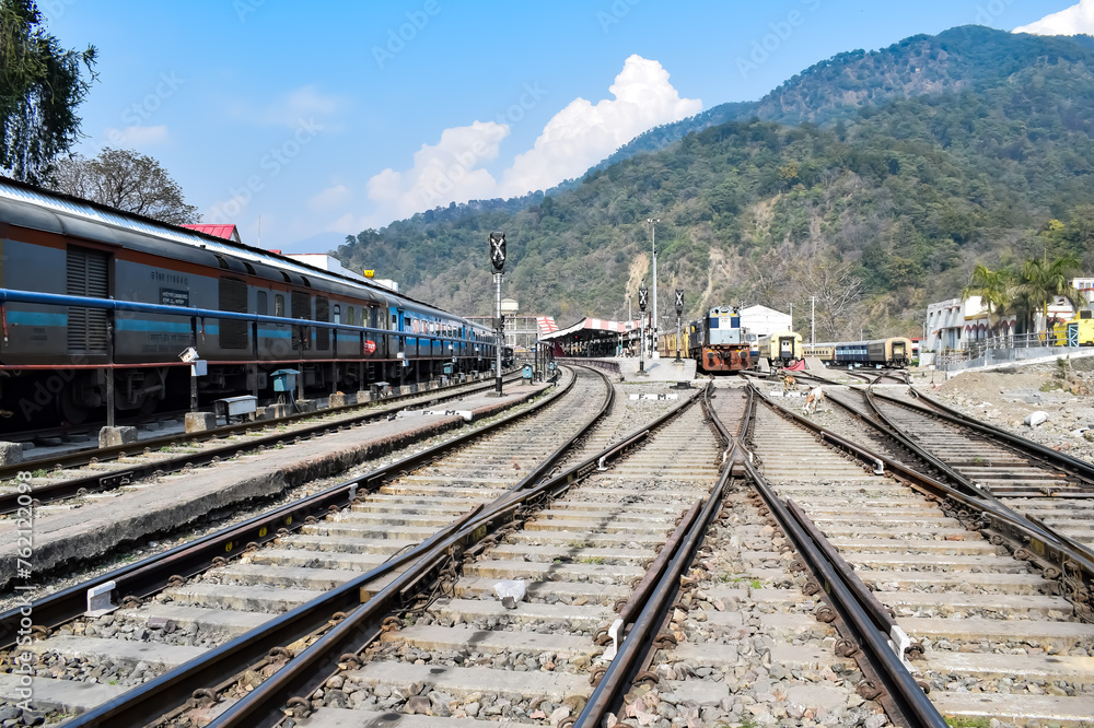 View of train Railway Tracks from the middle during daytime at Kathgodam railway station in India, Train railway track view, Indian Railway junction, Heavy industry View of train Railway Tracks from the middle during daytime at Kathgodam railway station in India, Train railway track view, Indian Railway junction, Heavy industry