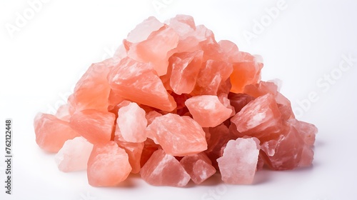 Bowl of pink himalyan rock salt  on white background photo