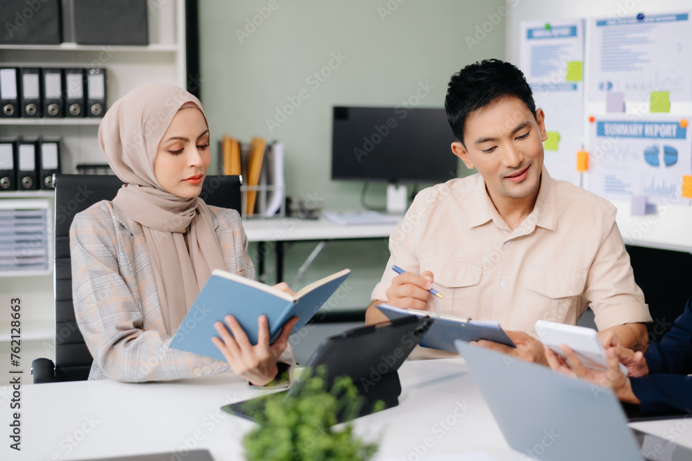 Business team discuss at meeting room. working together with laptop ,tablet and smart phone on desk Financial accountant at office Business team discuss at meeting room. working together with laptop ,tablet and smart phone on desk Financial accountant at office
