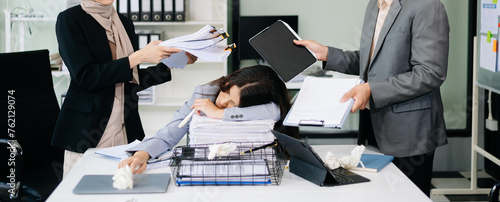 Furious Asian businesspeople arguing strongly after making a mistake at work in office