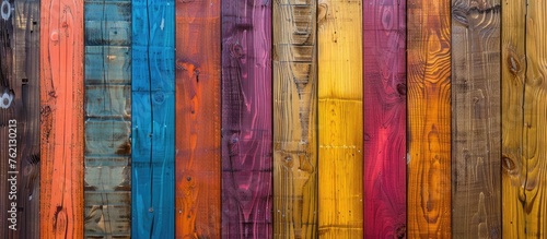 Vibrant wooden backdrop design. Multi-hued wooden plank surface.