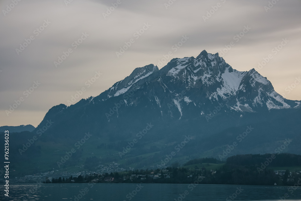 Scenic view of mountains with snowy peaks on lake lucerne.