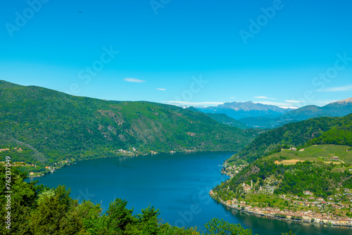 Aerail View over Morcote with Alpine Lake Lugano and Mountain in a Sunny Day in Ticino, Switzerland. © Mats Silvan