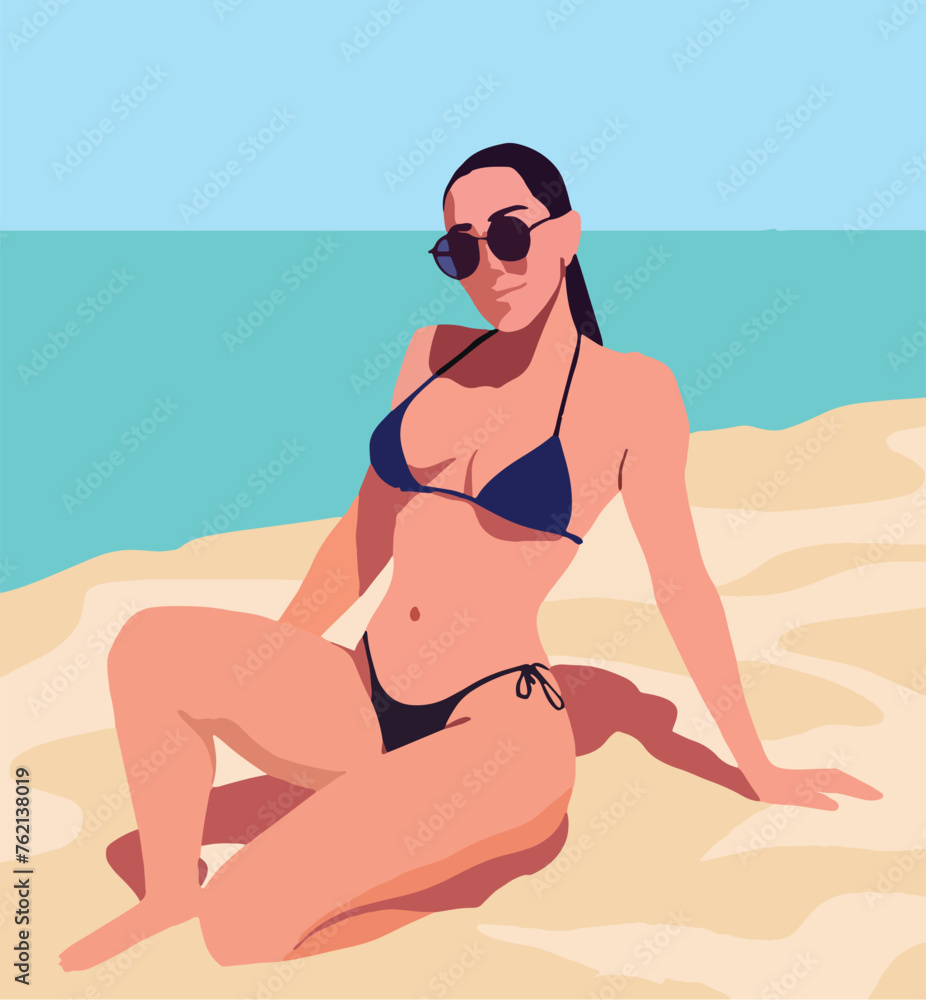 Woman in a bikini sits on the beach