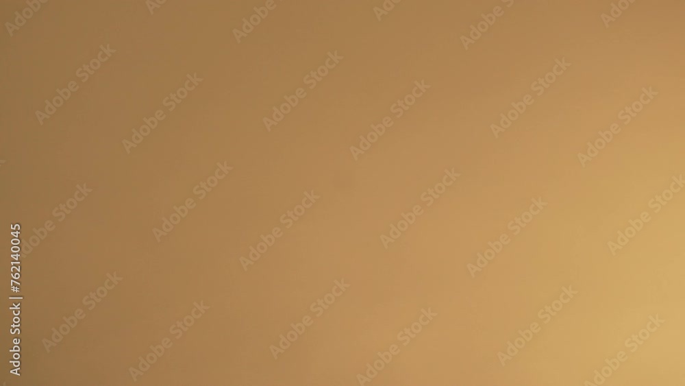 Blurred golden sea at sunset with shifting focus and bokeh effect. Sun reflects and sparkles on waves, illuminating golden sea. Holiday recreation concept. Abstract nautical summer ocean sunset nature Blurred golden sea at sunset with shifting focus and bokeh effect. Sun reflects and sparkles on waves, illuminating golden sea. Holiday recreation concept. Abstract nautical summer ocean sunset nature