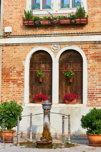 Detail of architecture and Iron Fountain in Murano, Venice, Veneto, Italy.