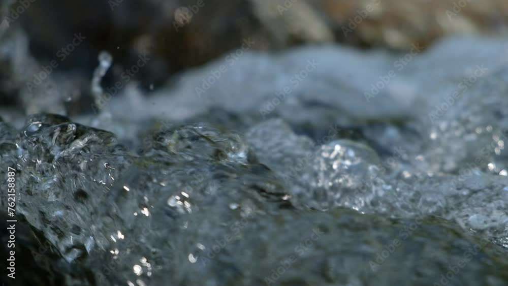 Closeup.Water flows quickly in a stream. Closeup.Water flows quickly in a stream.