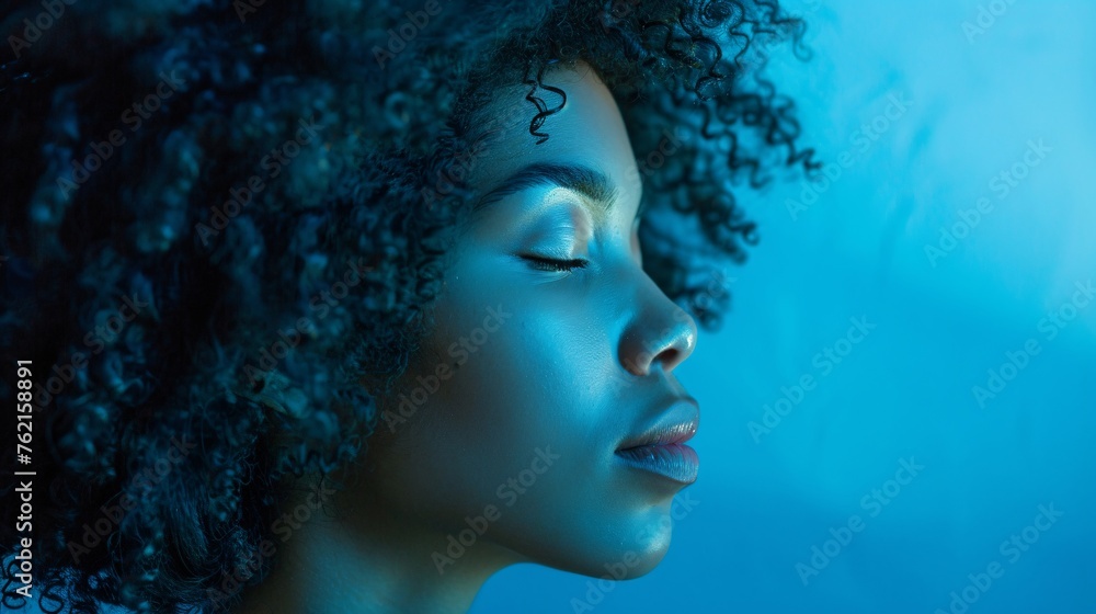 A captivating profile of an woman with curly hair A captivating profile of an woman with curly hair