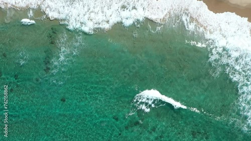 Beautiful blue ocean wave on fine sandy beach.
Dorone flight over the sea. photo