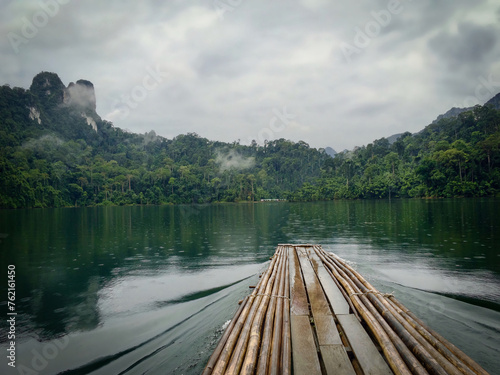 eco-travel on raft on tropcial rainforest lake photo