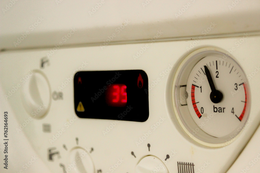 On off pause buttons and gauges on household devices close up view On off pause buttons and gauges on household devices close up view