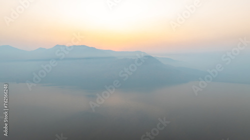 Lake panorama in a foggy morning. aerial view
