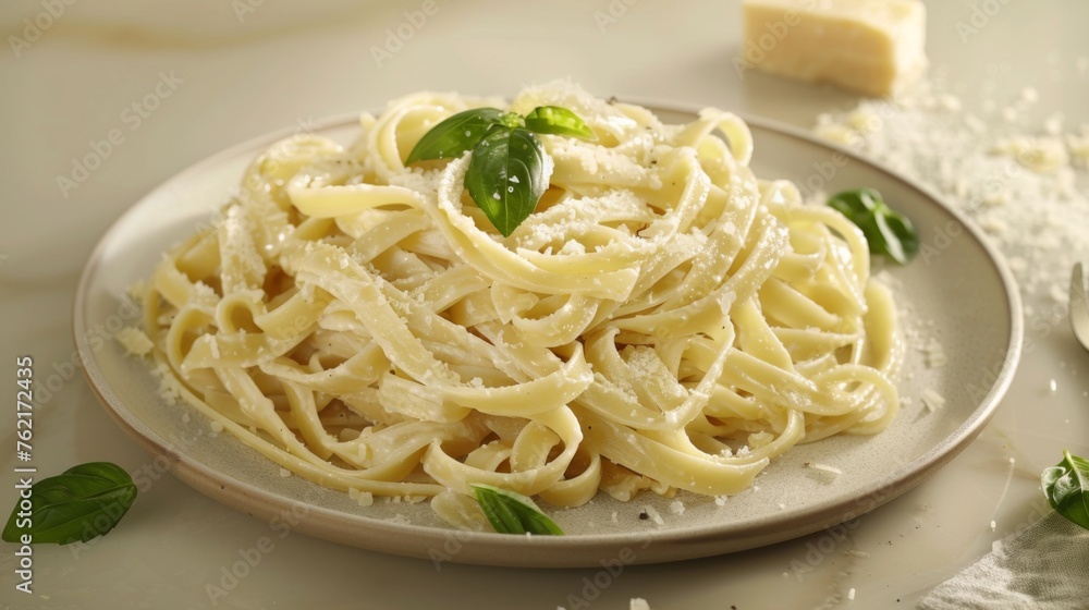 A twist on a classic, this plate of Fettuccine Alfredo is graced with basil and an abundant sprinkling of Parmesan, invoking the essence of Italian cuisine.