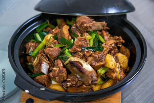 A pot of delicious braised duck with water chestnuts, home cooking photo