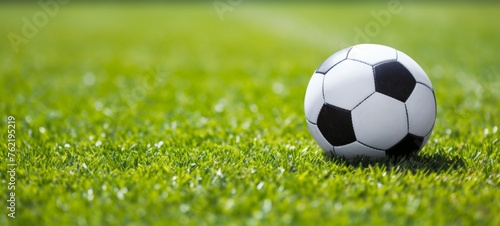 Soccer sport equipment background banner - Close up of football soccerball on fresh green meadow soccer field