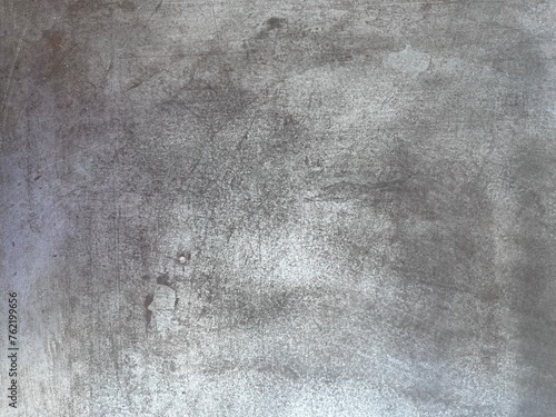 The metal background is full of scratches.